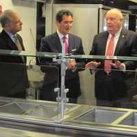 <p>New Covenant House Executive Director John Gutman, Ernie Anastos, Al Barber, president of Catholic Charities and Paul Harinstein, chairman of the board, New Covenant House, tour the soon-to-open expanded New Covenant House facility in Stamford.</p>