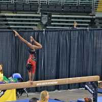 <p>Carlee Reeid performs on the balance beam during a competition in St. Louis.</p>