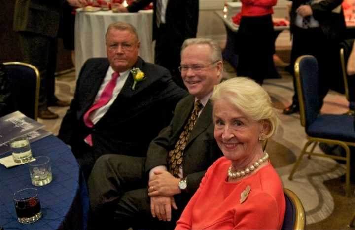 Caryl Plunkett with William Plunkett (L) and Carll Tucker at a fundraiser for Stepinac High School in April. 