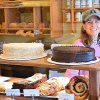 <p>Behind the treats counter at Ross&#x27; Bread is new owner Amy Freidenrich. </p>