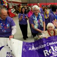 <p>Dorothy Holland, a 50-year cancer survivor, beams as she leads the parade of survivors at Friday&#x27;s Relay for Life at Sacred Heart University in Fairfield.</p>