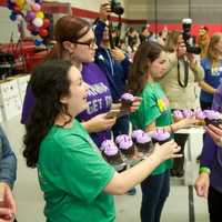 <p>Survivors celebrate with cupcakes.</p>