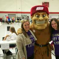 <p>Students pose with Sacred Heart&#x27;s mascot Big Red.</p>