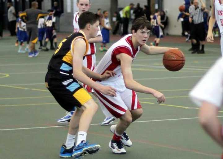 Staples High sophomore, Justin Seideman advances the ball for Academic Basketball Club&#x27;s U-16 team.
