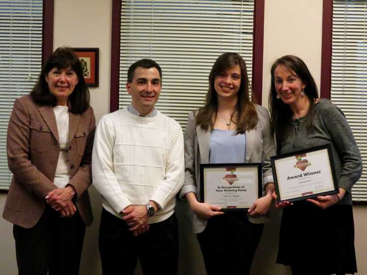 From left, Briarcliff High School Principal Debora French, Barnes &amp; Noble representative Charles DiSimone, Briarcliff High School senior Olivia Segal, and French teacher Samantha Boyer.