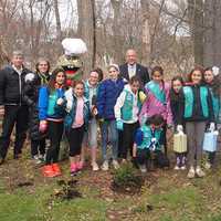 <p>Almstead arborist Michael Marks, left, with Judith Blau, second from left, creator of Treetures, Eastchester Supervisor, Anthony Colavita, middle, and local Girl Scouts at the Magic Treetures Forest Nursery in Eastchester.</p>