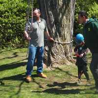 <p>Almstead foreman and climber Mike Perez and climber Hugo Rosa assist a junior climber at Wave Hill Public Garden and Cultural Center in the Bronx.</p>