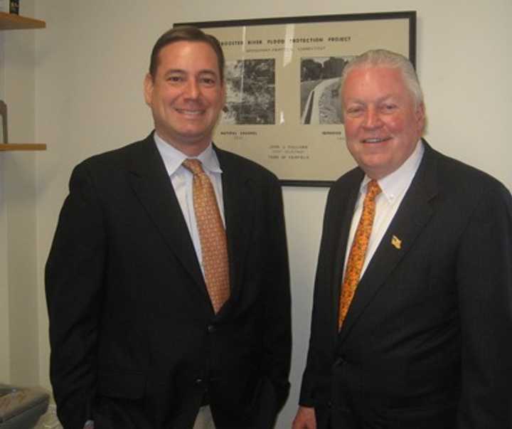 First Selectman Mike Tetreau welcomes Brian Carey to his new office as conservation director for the town of Fairfield.