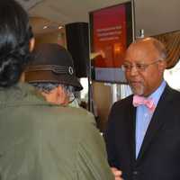 <p>Michael C. Pitter, MD, Columbia obstetrician/gynecologist and da Vinci Robot surgeon, talks with attendees after the presentation.
</p>