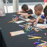 <p>Kids decorate Mother&#x27;s Day cards at booth sponsored by Whole Foods Market. </p>