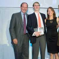 <p>Rob, Nick, Kit and Katie Rohn of Darien accept a 2015 Red Apple Award during The Maritime Aquarium at Norwalks Cirque de la Mer fundraising gala April 23.</p>