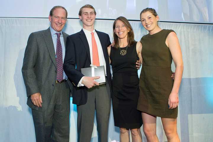 Rob, Nick, Kit and Katie Rohn of Darien accept a 2015 Red Apple Award during The Maritime Aquarium at Norwalks Cirque de la Mer fundraising gala April 23.