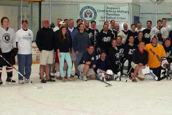 Some of the 200 players in a marathon hockey game in Ridgefield this weekend get ready to skate. The game will benefit Play For Purpose.