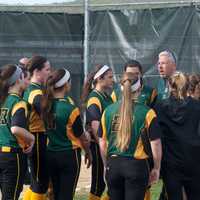 <p>Lakeland coach Joe Chiara talks to his team between innings. </p>