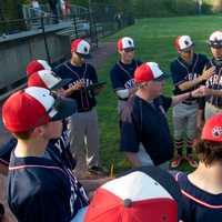 <p>The Bobcats talk it over between innings. </p>