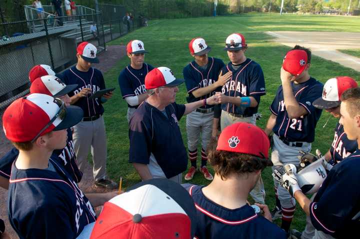 The Bobcats talk it over between innings. 