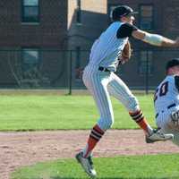 <p>Mamaroneck shortstop Anthony Pecora makes a throw to first, as his second baseman gets out of the way.</p>