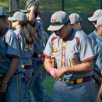 <p>Mt. Vernon players walk to dugout.</p>