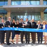 <p>Cutting the ribbon, from left, William Mooney III, Deputy County Executive Kevin Plunkett; Joanna Simone, Patricia Simone, Joseph Simone, Anthony Viceroy of WESTMED, Pat Simone, John Fareri, Brenda Fareri and Town of Harrison Supervisor Ron Belmont.</p>