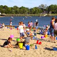 <p>Families relaxing on a bright, sunny day at Weed Beach in Darien. Several Fairfield County communities, including Darien were named among the best suburbs in Connecticut to live in. </p>