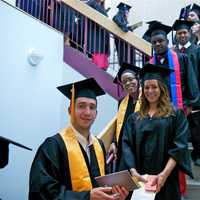 <p>Graduating students fill the staircase. </p>