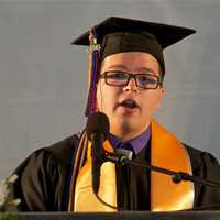 <p>Joshua Kleinwaks, a class speaker, addresses the crowd.</p>