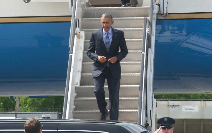 President Barack Obama steps off Air Force One at Westchester County Airport on his way to a fundraiser in Stamford. 