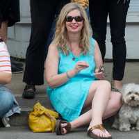 <p>This woman and her dog found a great seat for the parade.</p>