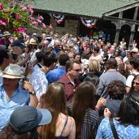 <p>A packed crowd circles around Hillary Clinton after the Memorial Day parade in Chappaqua.</p>