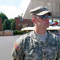 <p>An Army veteran watches the parade in Fairfield.</p>