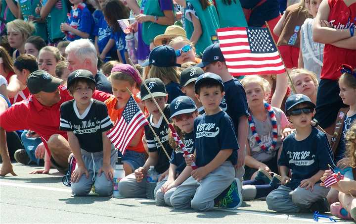 A group of Little Leaguers watches the Memorial Day parade in Fairfield in a past year.