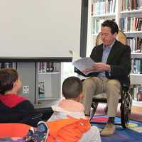 <p>Head of School Matt Byrnes reads &quot;Dragons Love Tacos&quot; to Wooster School&#x27;s pre-K class at the Scholastic Book Fair.</p>