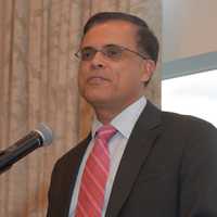 <p>Dr. Sumir Sahgal accepts his award at the VNSW gala.</p>