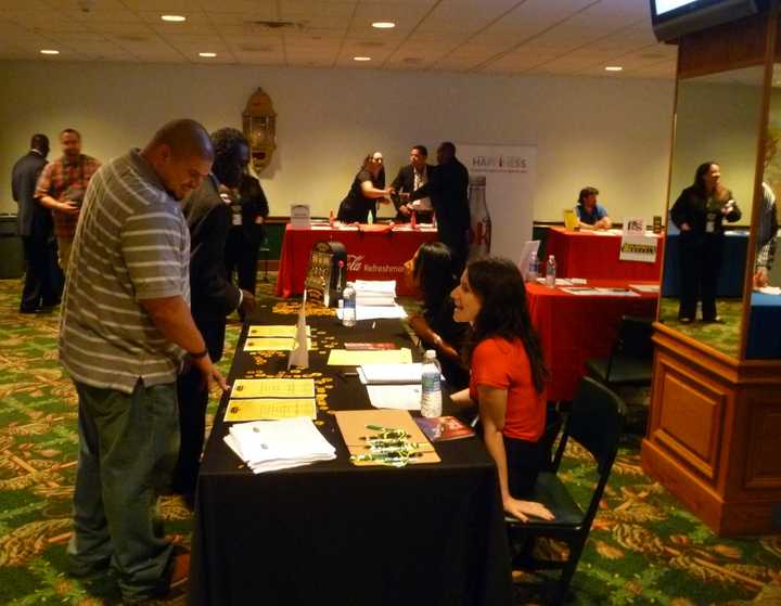 People looking for work fill a recent job fair. 