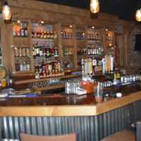 <p>The bar at Hoodoo Brown BBQ serves up all your favorites. </p>