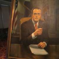 <p>A painting of Al DelBello next to the speaker&#x27;s podium at Thursday&#x27;s memorial service.</p>