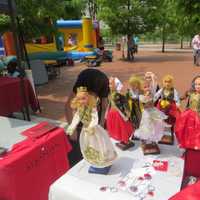 <p>Some of the dolls on sale Sunday, along with traditional hats and T-shirts displaying the Albanian flag.</p>