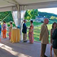 <p>Guests enjoy cocktails at the Westchester Land Trust benefit at Old Salem Farm.</p>