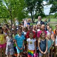 <p>Rep. Shaban and RES second and fourth graders stand by their new tree.</p>