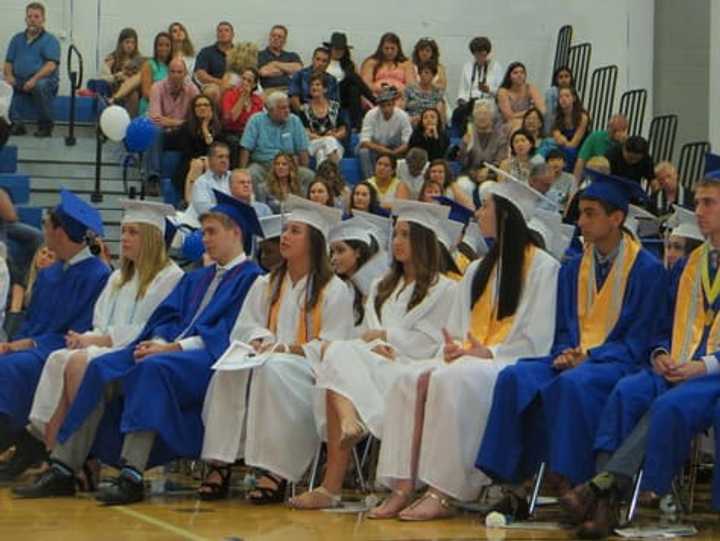 Some of the Class of 2015 graduates at Dobbs Ferry High School listening to Sasha Clarick&#x27;s valedictorian speech on Saturday evening. 