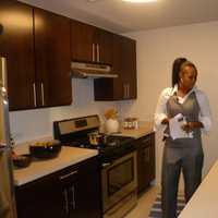 <p>Megan Martin inspects a model apartment in the affordable housing complex unveiled Thursday at 49 N. Broadway. Martin will be one of the tenants in the building when it opens later this fall.</p>