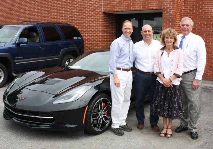 From left, Steve Karl, vice president of Karl Chevrolet; John Polera; Joanne Boyer, director of development for Waveny LifeCare Network; and Jim Darling, senior vice president of First County Bank.