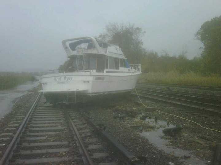 A boat washed up onto train tracks in Ossining Tuesday morning due to Hurricane Sandy. 