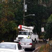 <p>Trees on wires have blocked off part of the neighborhood beyond the Old Albany Post Road S-curve in Ossining.</p>