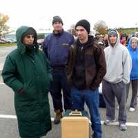 <p>Nathaniel Fasman (right) stands in  line with his mother, Barbara, to get dry ice Wednesday at Empire City Casino in Yonkers.</p>