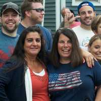 <p>Spectators enjoying the break in the rain for Sunday&#x27;s parade.</p>