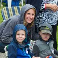 <p>Families line the streets to watch the Great Street Parade Sunday in Bridgeport.</p>