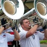 <p>The Caballeros Drum &amp; Bugle Corps marches in Sunday&#x27;s parade.</p>