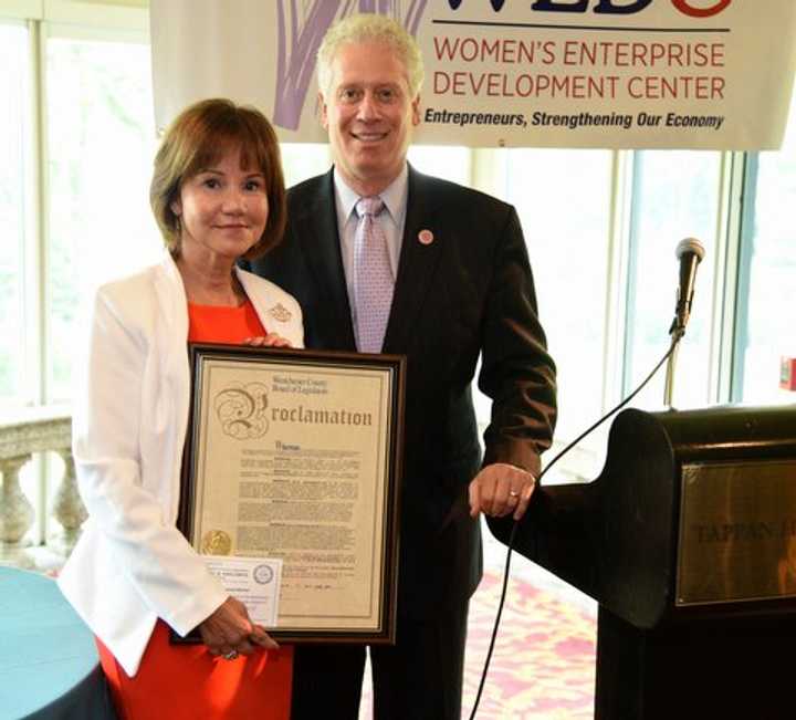 Millie Hernandez-Becker with Michael B. Kaplowitz, chairman of the board of the Westchester County Board of Legislators.