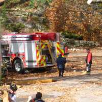 <p>Members of the Rowayton Volunteer Fire Department respond to a garage fire Friday on Little Brook Road.</p>